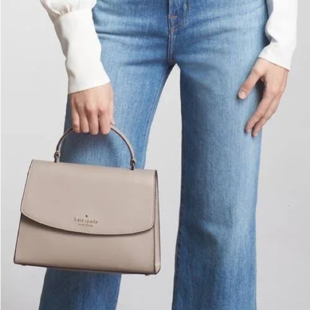 Kate Spade Darcy Satchel in taupe color with black piping